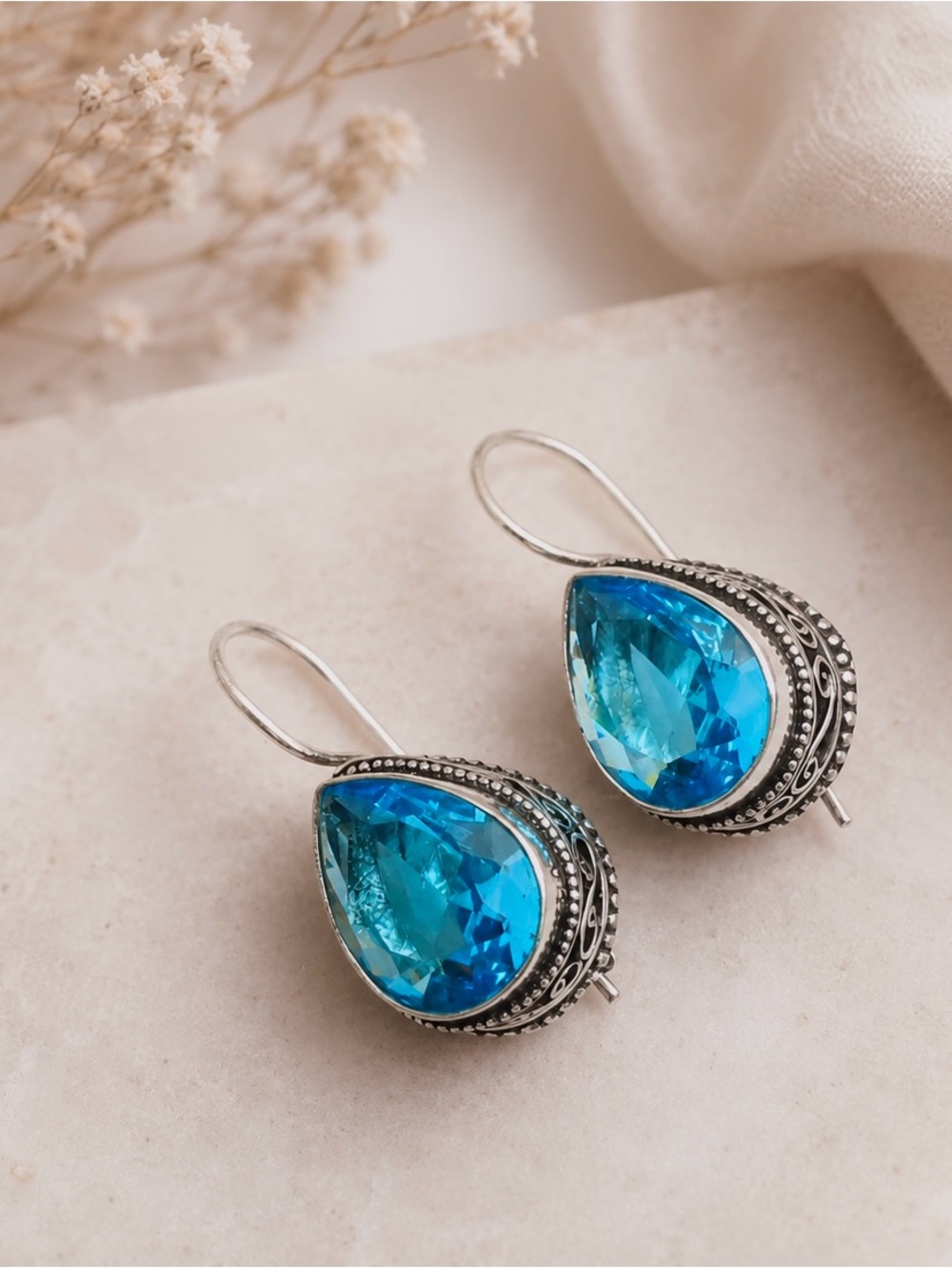 Teardrop Blue Topaz Sterling Silver 1.3” Earrings.